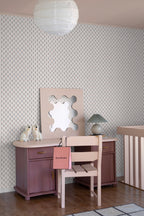 Betty wallpaper by Sandberg in a bedroom corner, small floral sprig pattern behind a mauve desk, wavy mirror and rice-paper pendant