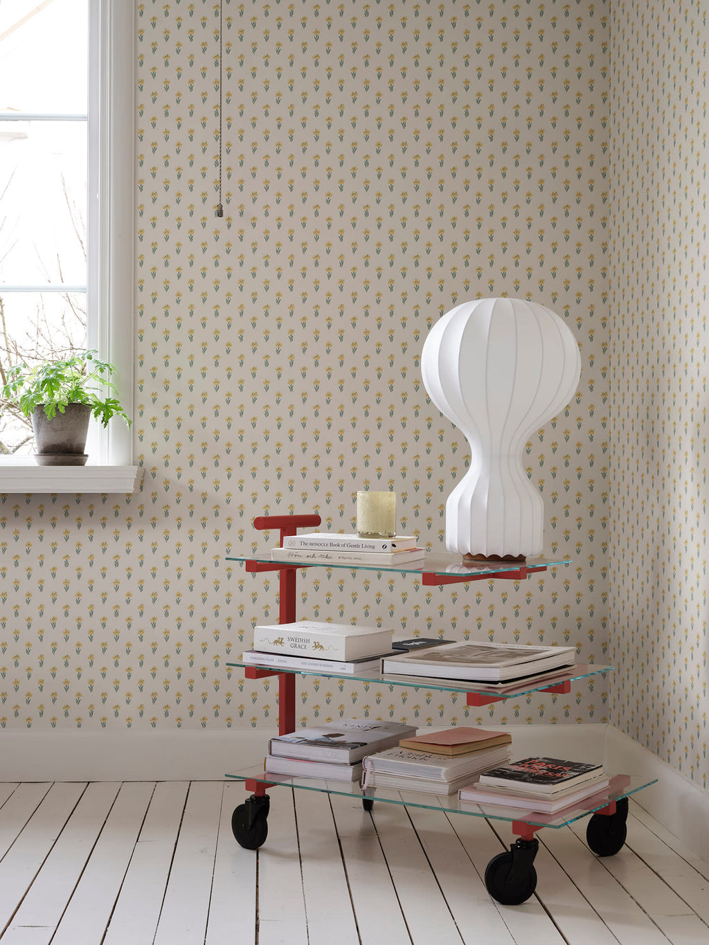 Betty wallpaper by Sandberg in Yellow, styled on an interior wall