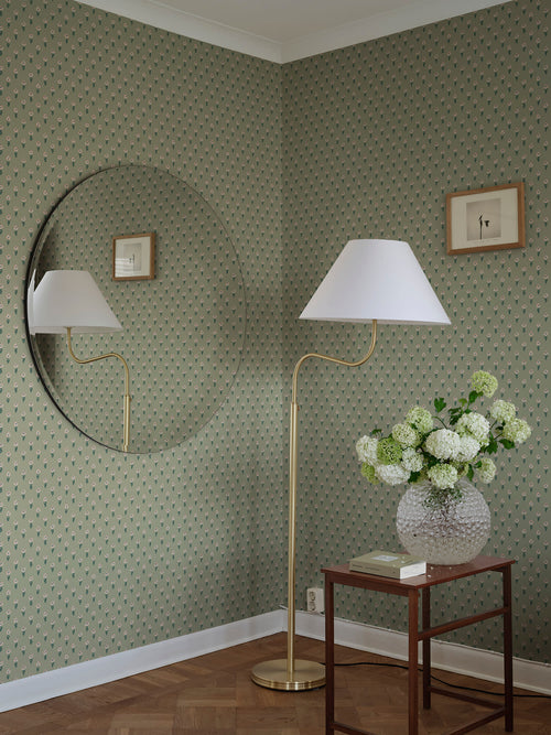Betty wallpaper by Sandberg in Green, styled on an interior wall
