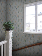 Hanna wallpaper by Sandberg in Misty Blue, styled on an interior wall