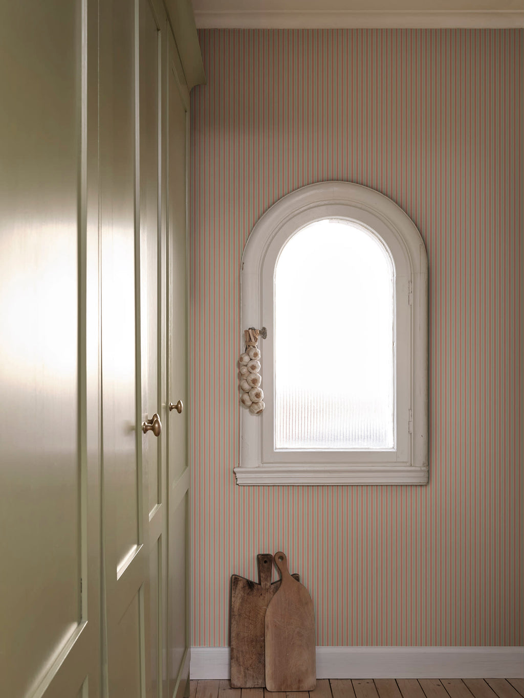 Linn wallpaper by Sandberg in Pink, styled on an interior wall