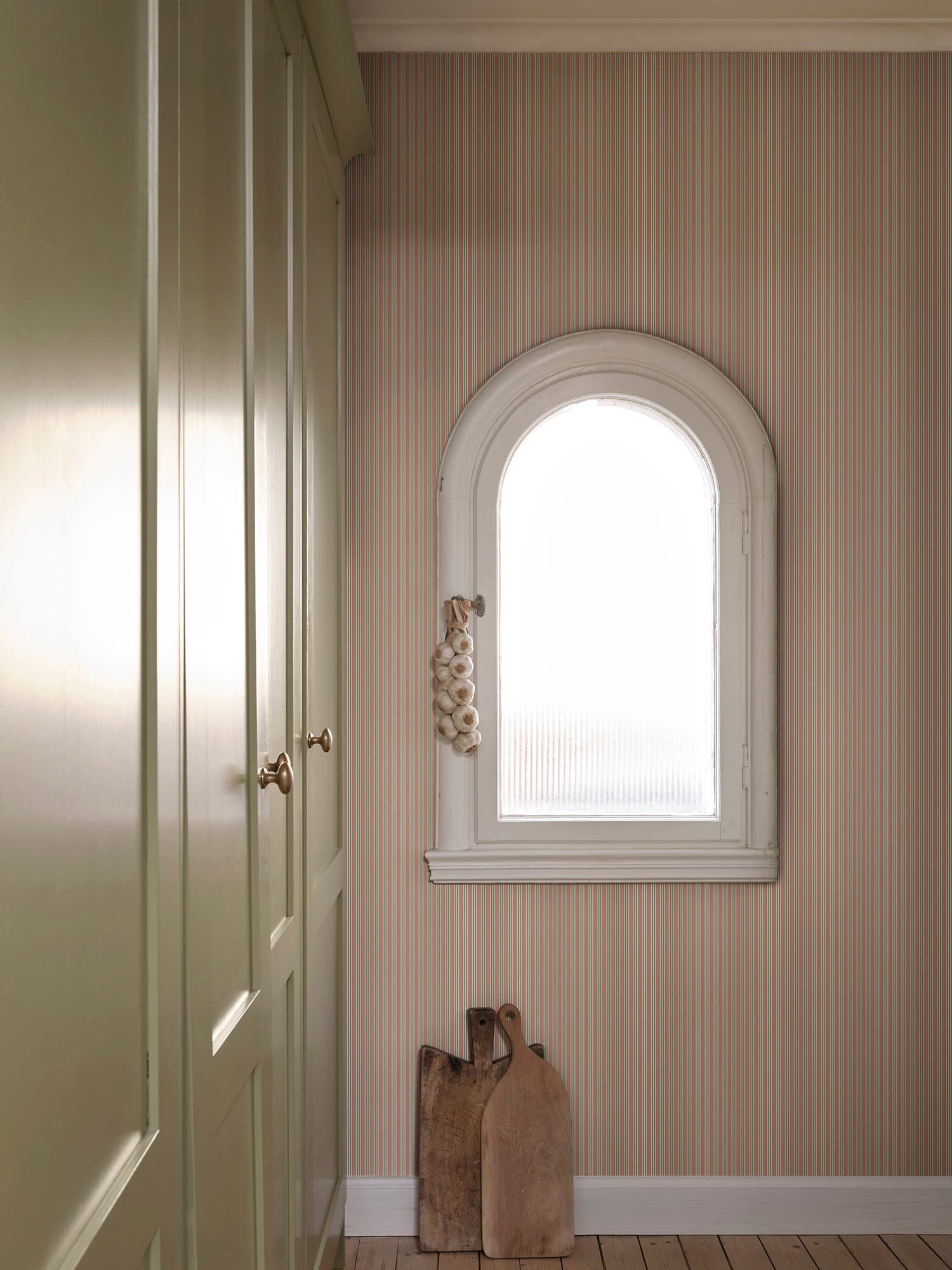 Linn wallpaper by Sandberg in Pink, styled on an interior wall