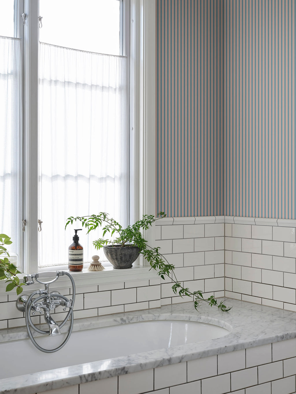 Linn wallpaper by Sandberg in Sky Blue, styled on an interior wall