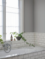 Linn wallpaper by Sandberg in Sky Blue, styled on an interior wall
