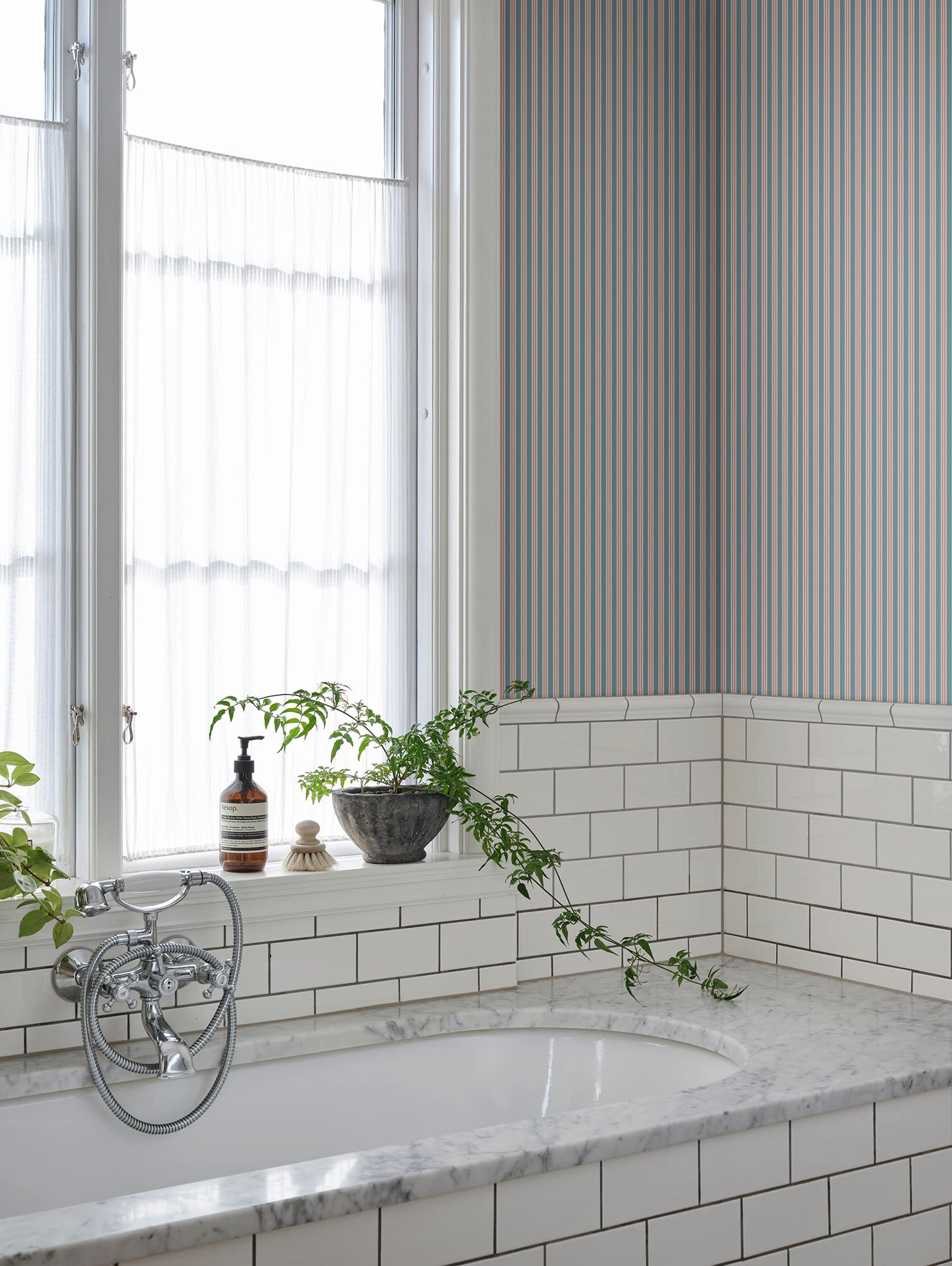 Linn wallpaper by Sandberg in Sky Blue, styled on an interior wall