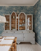 Forest Toile wall mural by Sandberg in a dining room behind a grey glazed dresser, blue woodland toile pattern