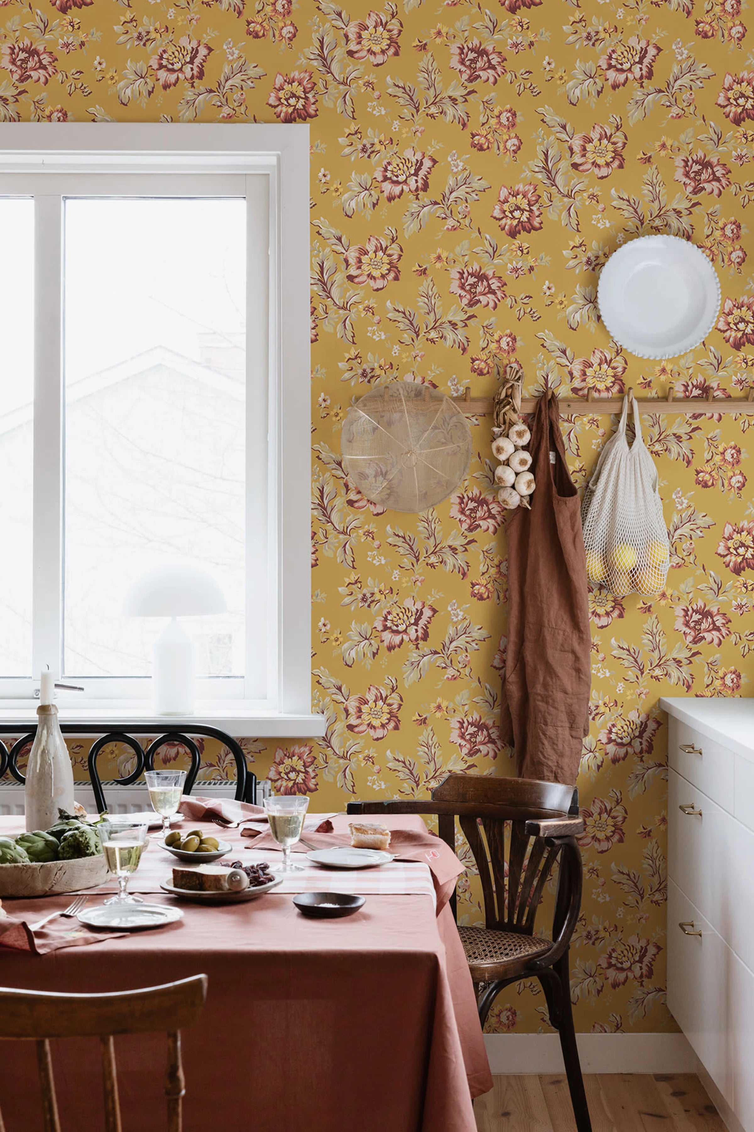 Rosenholm wallpaper by Sandberg – floral design, Yellow, styled on an interior wall
