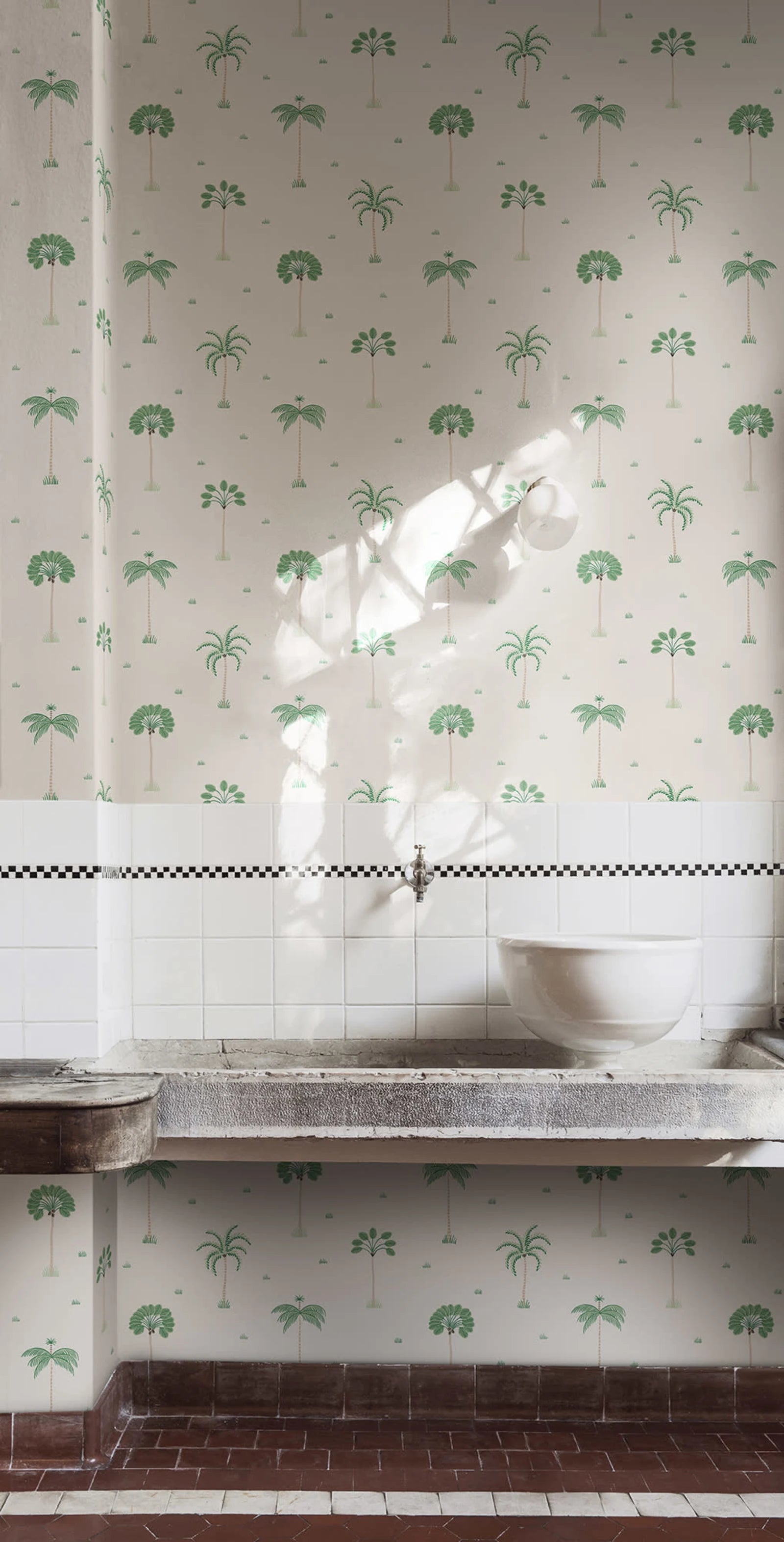 Milo Palms wallpaper by Sandberg in green on blush, styled in a scullery above a stone trough sink and tiled splashback
