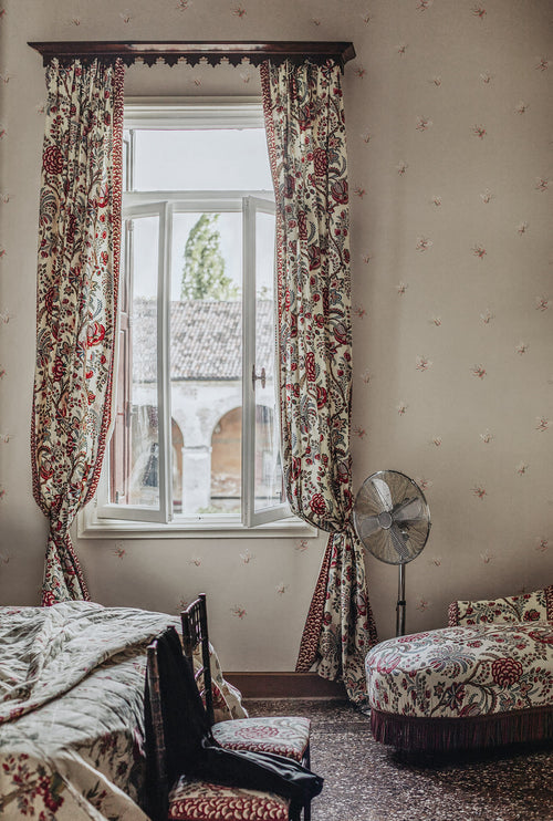 Butterflies wallpaper by Sandberg in Sandstone shown on a wall in a styled room, styled on an interior wall