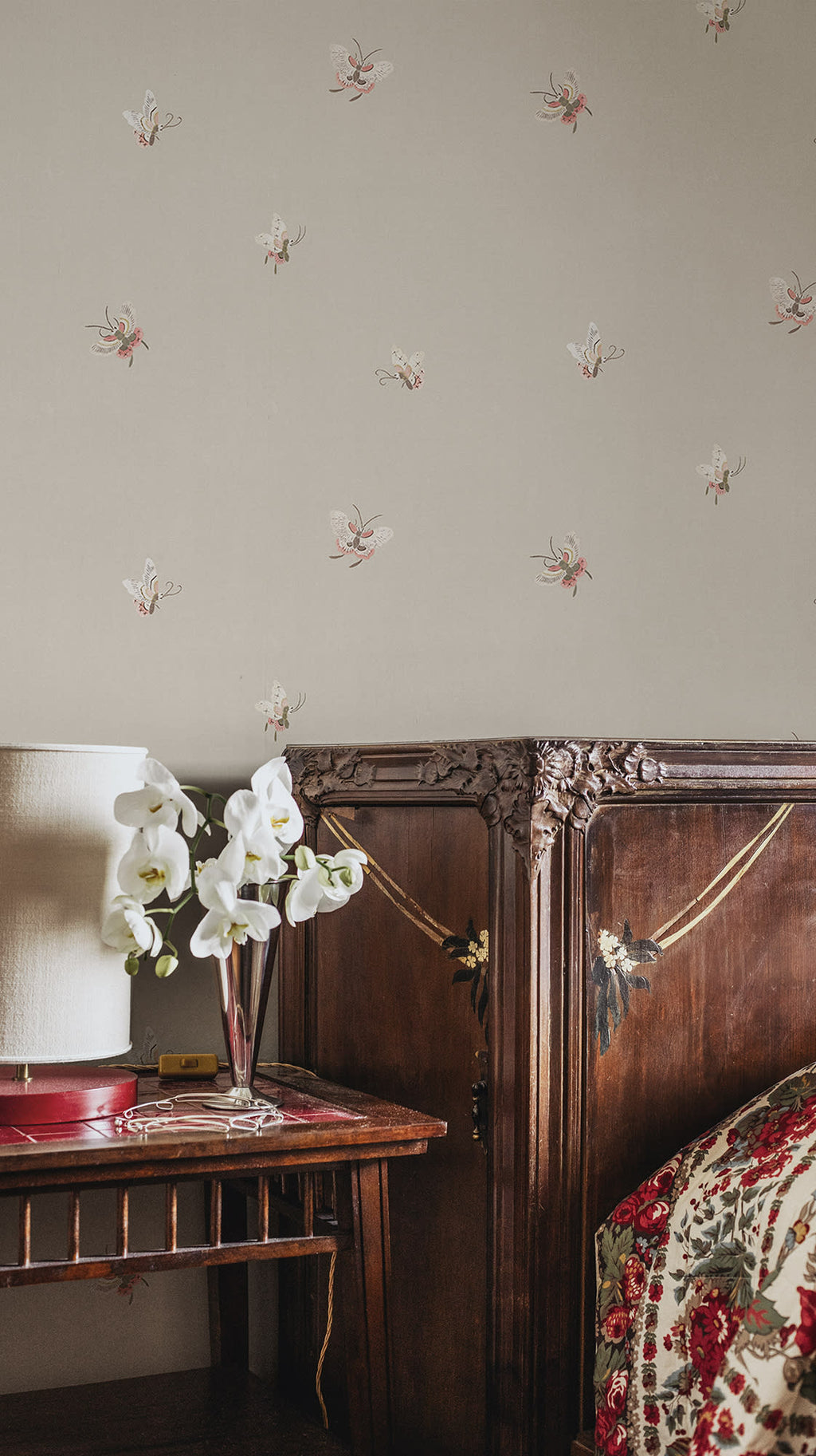 Butterflies wallpaper by Sandberg in Sandstone shown on a wall in a styled room