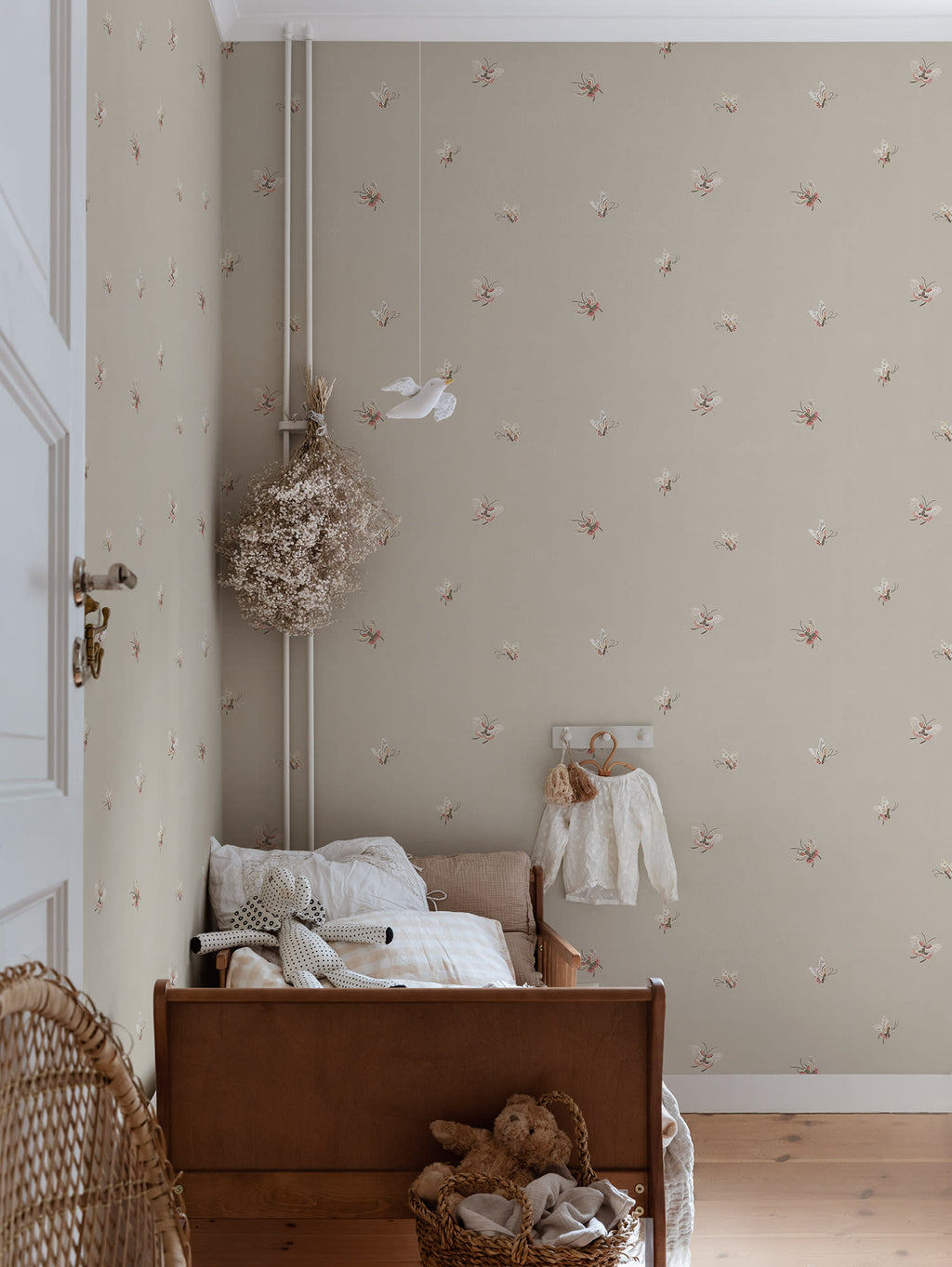 Butterflies wallpaper by Sandberg in Sandstone shown on a wall in a styled room