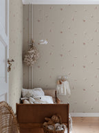 Butterflies wallpaper by Sandberg in Sandstone shown on a wall in a styled room