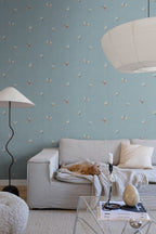 Butterflies wallpaper by Sandberg in Misty Blue shown on a wall in a styled room