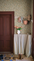 Emrik wallpaper by Sandberg in Oat, styled on an interior wall