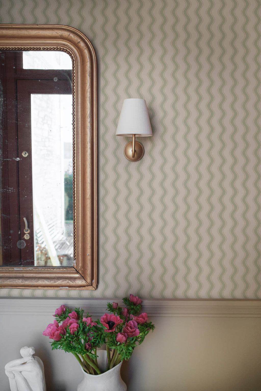 Erik wallpaper by Sandberg in Spring Green, styled on an interior wall