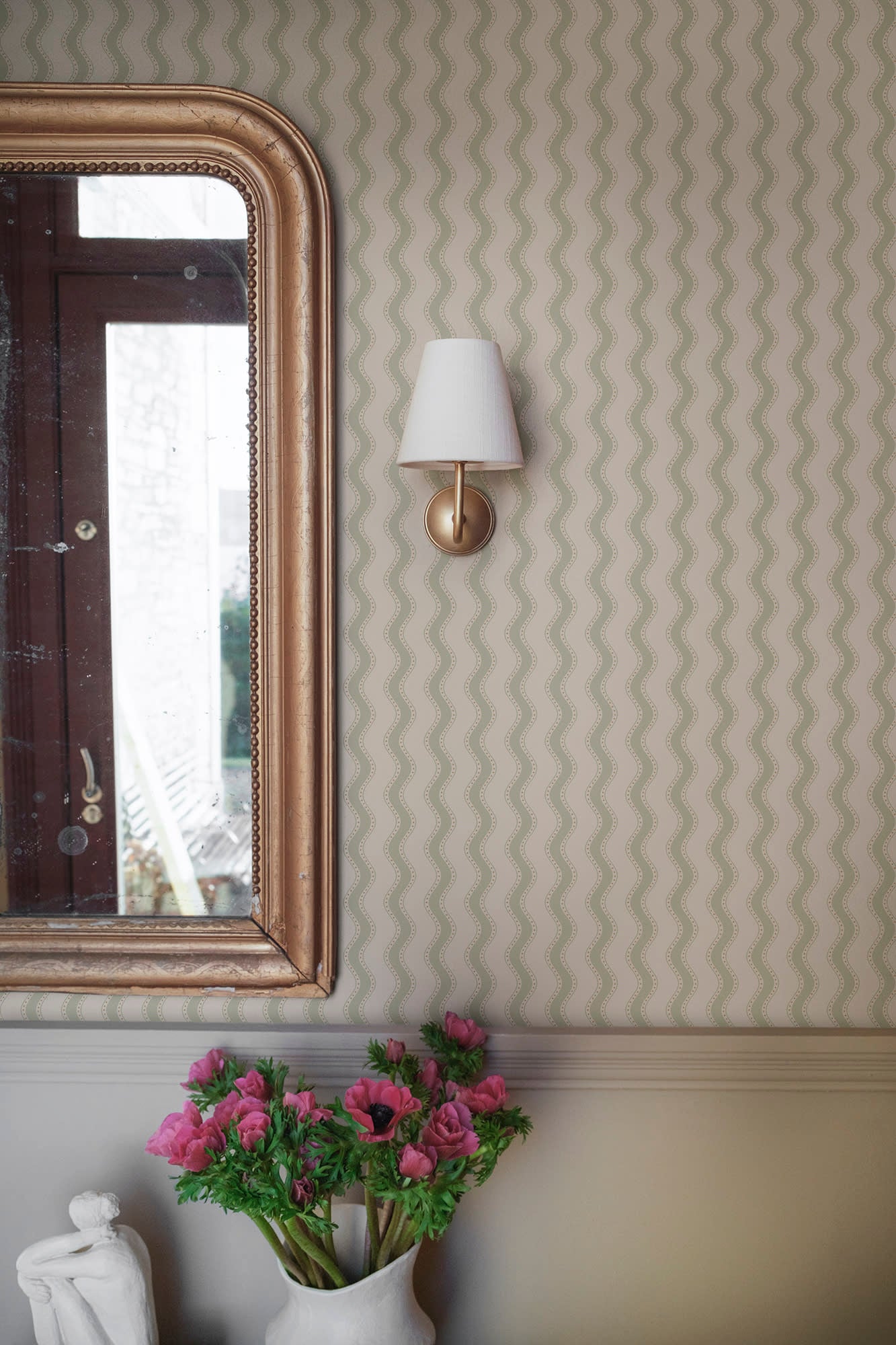 Erik wallpaper by Sandberg in Spring Green, styled on an interior wall