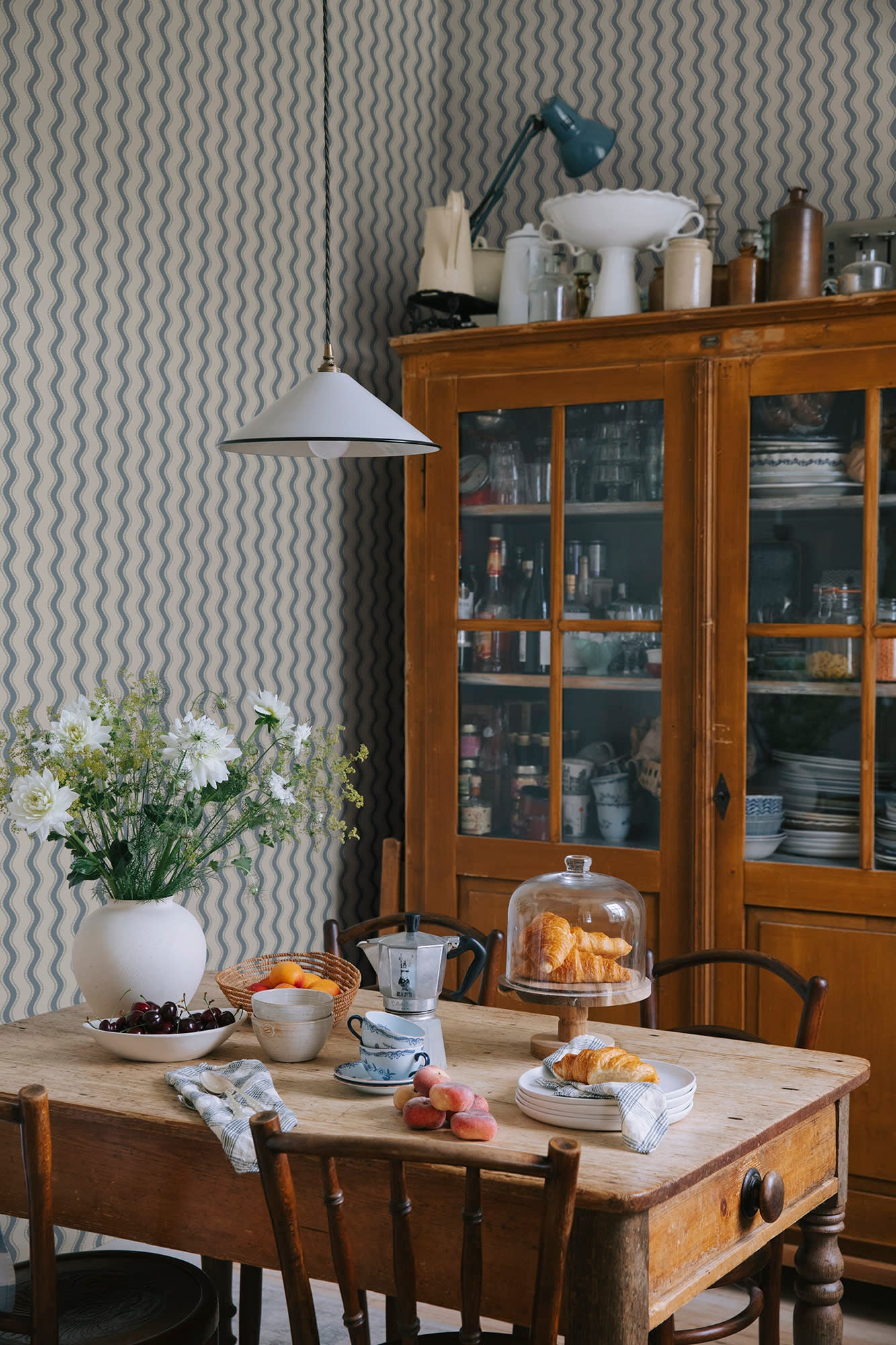 Erik wallpaper by Sandberg in Indigo Blue, styled on an interior wall