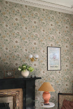 Solveig wallpaper by Sandberg in neutral tones styled in a living room with a black fireplace and coral lamp