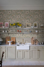 Solveig wallpaper by Sandberg in beige styled in a kitchen with open shelving, framed art and a butler sink