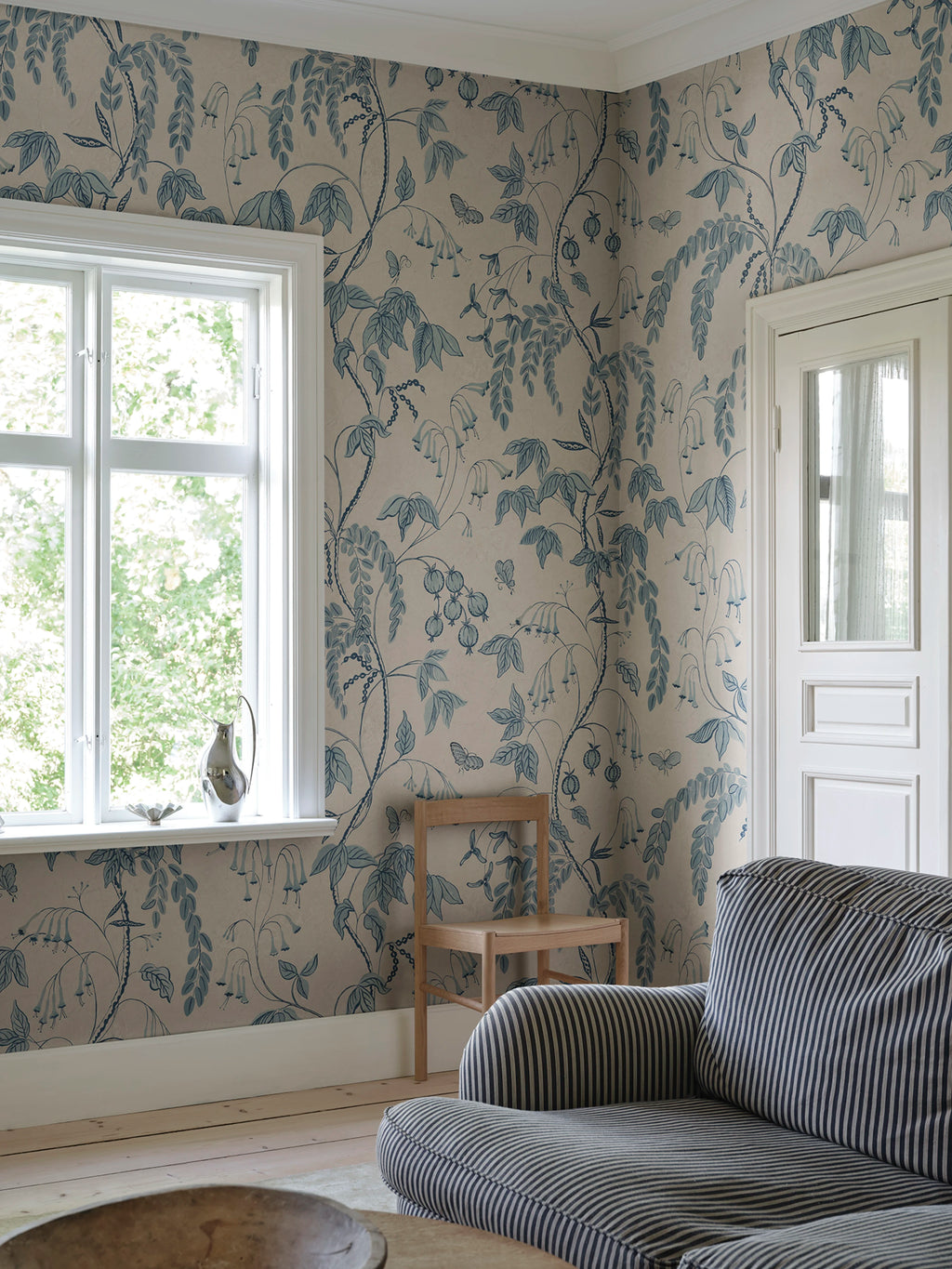 Ottilia wallpaper by Sandberg – Light Blue colourway, styled on an interior wall