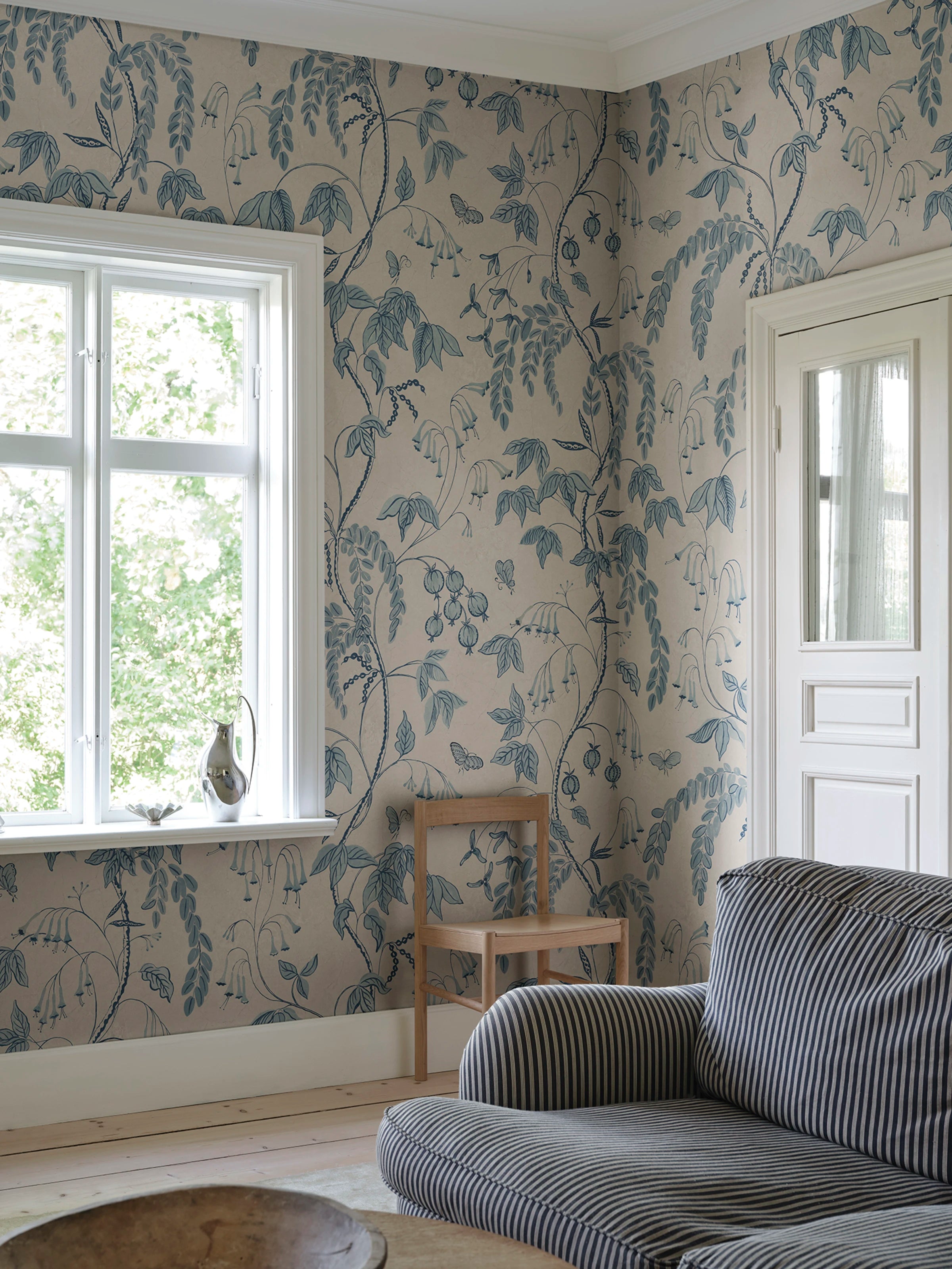 Ottilia wallpaper by Sandberg – Light Blue colourway, styled on an interior wall