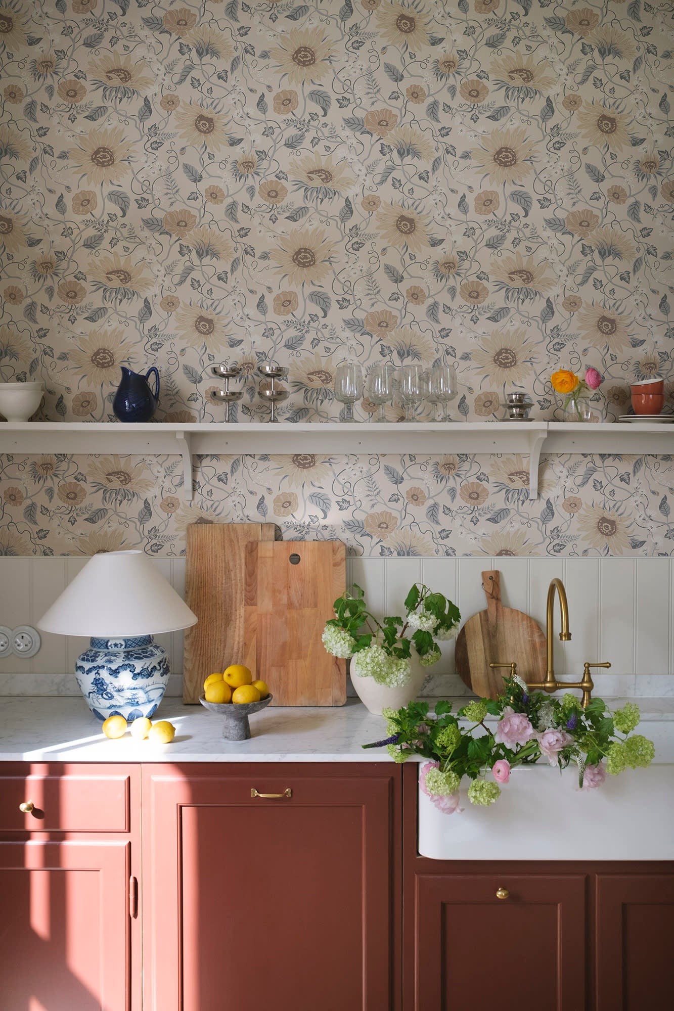 Solveig wallpaper by Sandberg in Misty Blue, styled on an interior wall