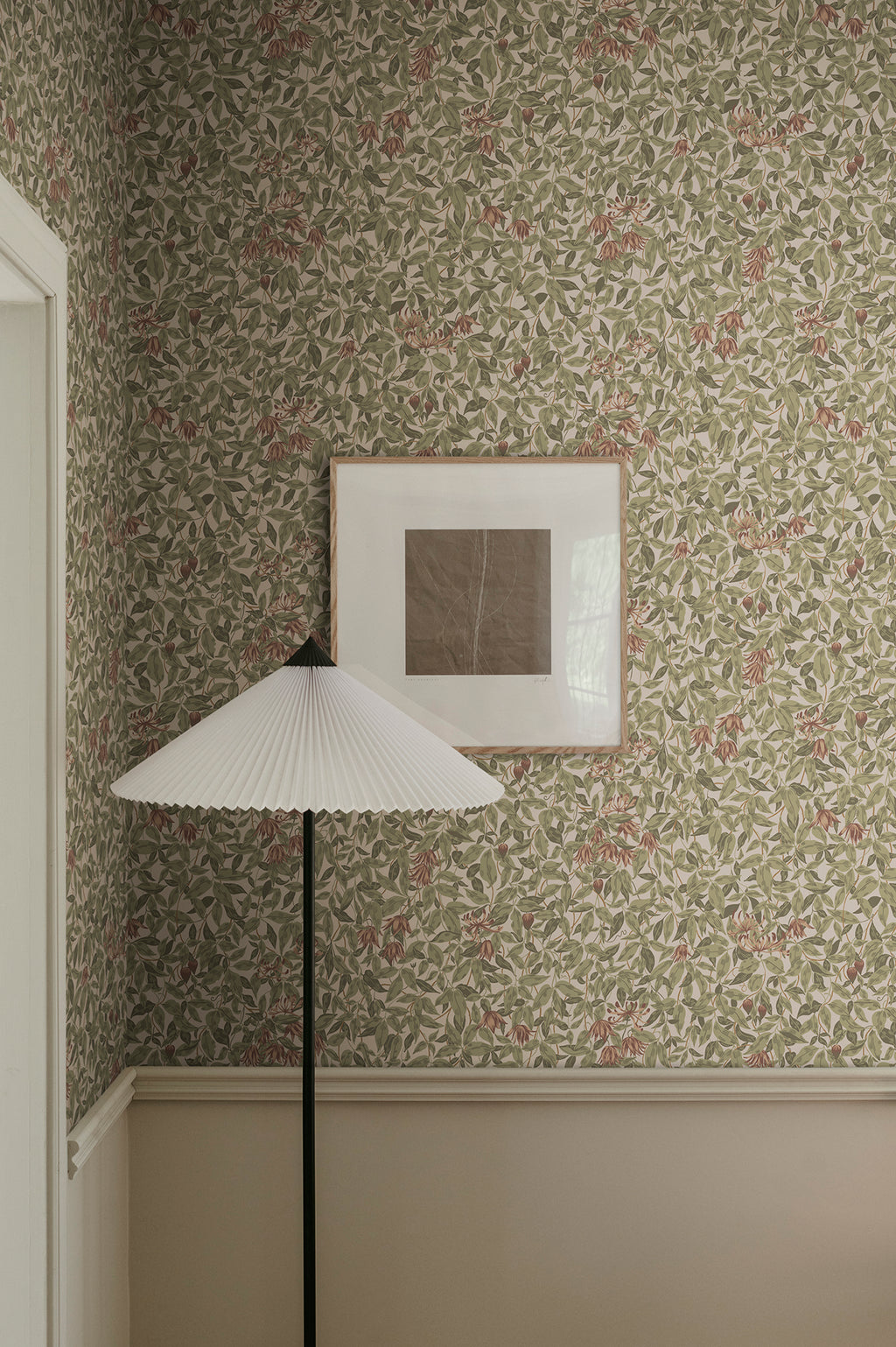 Linnea wallpaper by Sandberg in Burgundy, styled on an interior wall