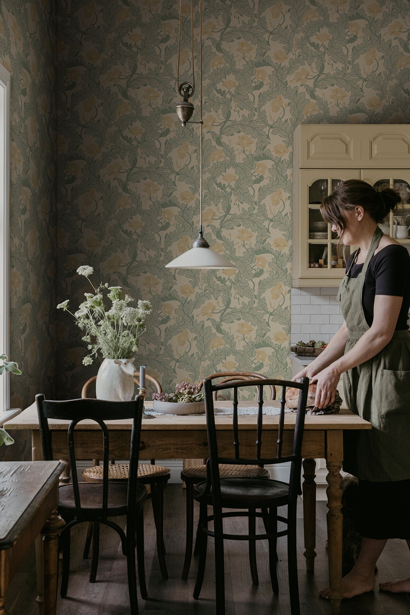 Charlotta wallpaper by Sandberg in Yellow, styled on an interior wall