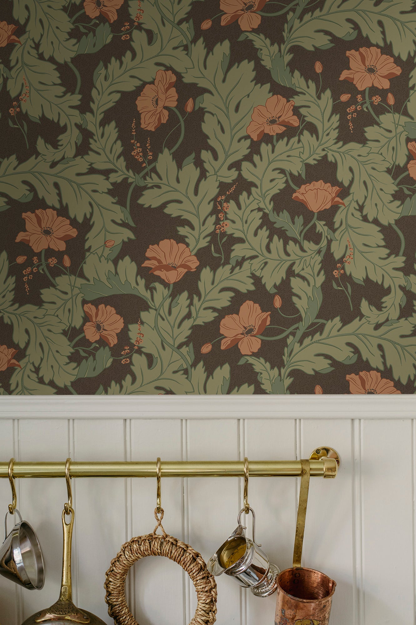 Charlotta wallpaper by Sandberg, terracotta poppies on brown, close-up above white panelling in a kitchen