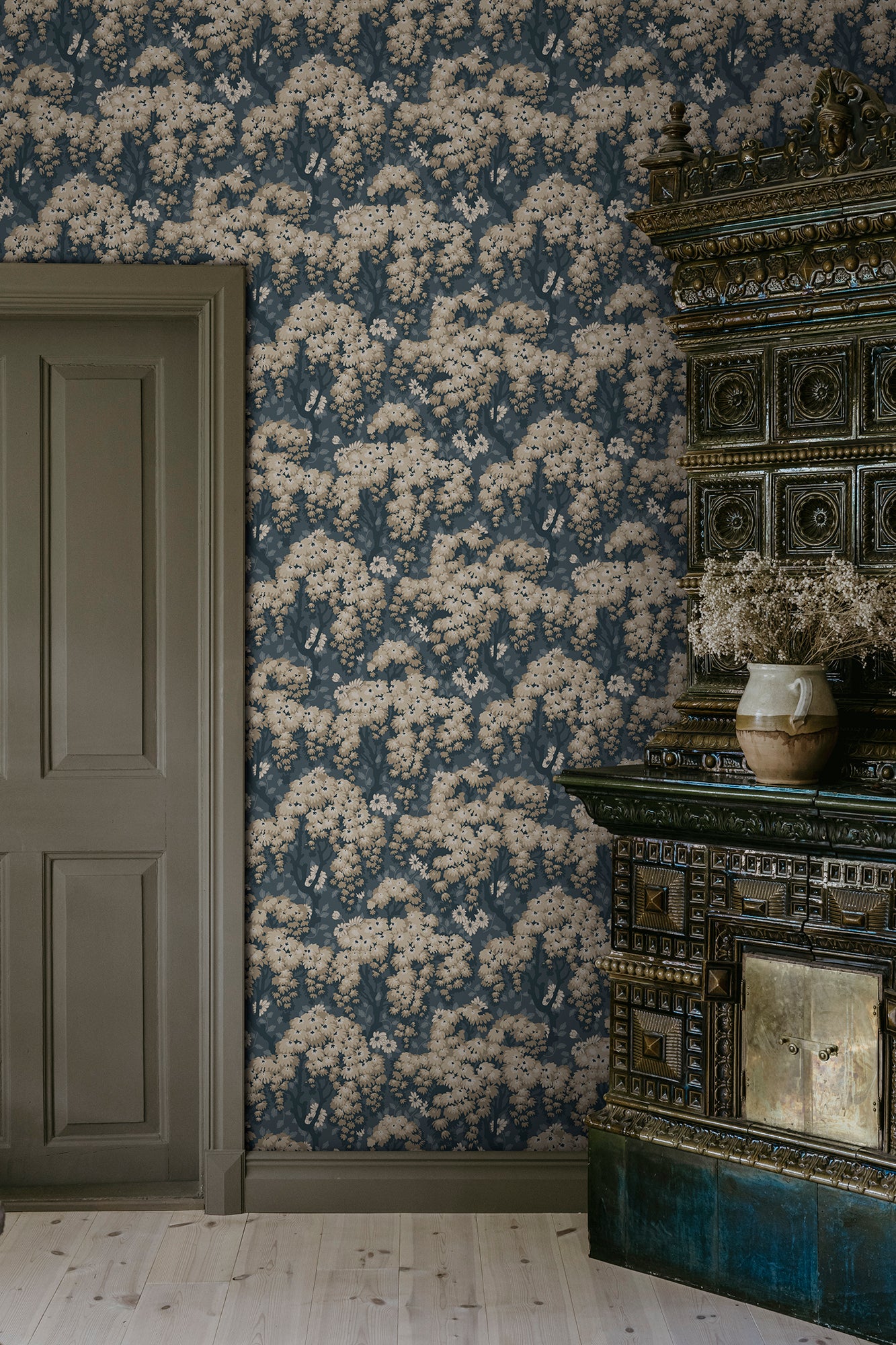 Ragnvi wallpaper by Sandberg in Midnight Blue, styled on an interior wall