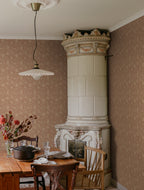 Anton wallpaper by Sandberg in Terracotta, styled on an interior wall