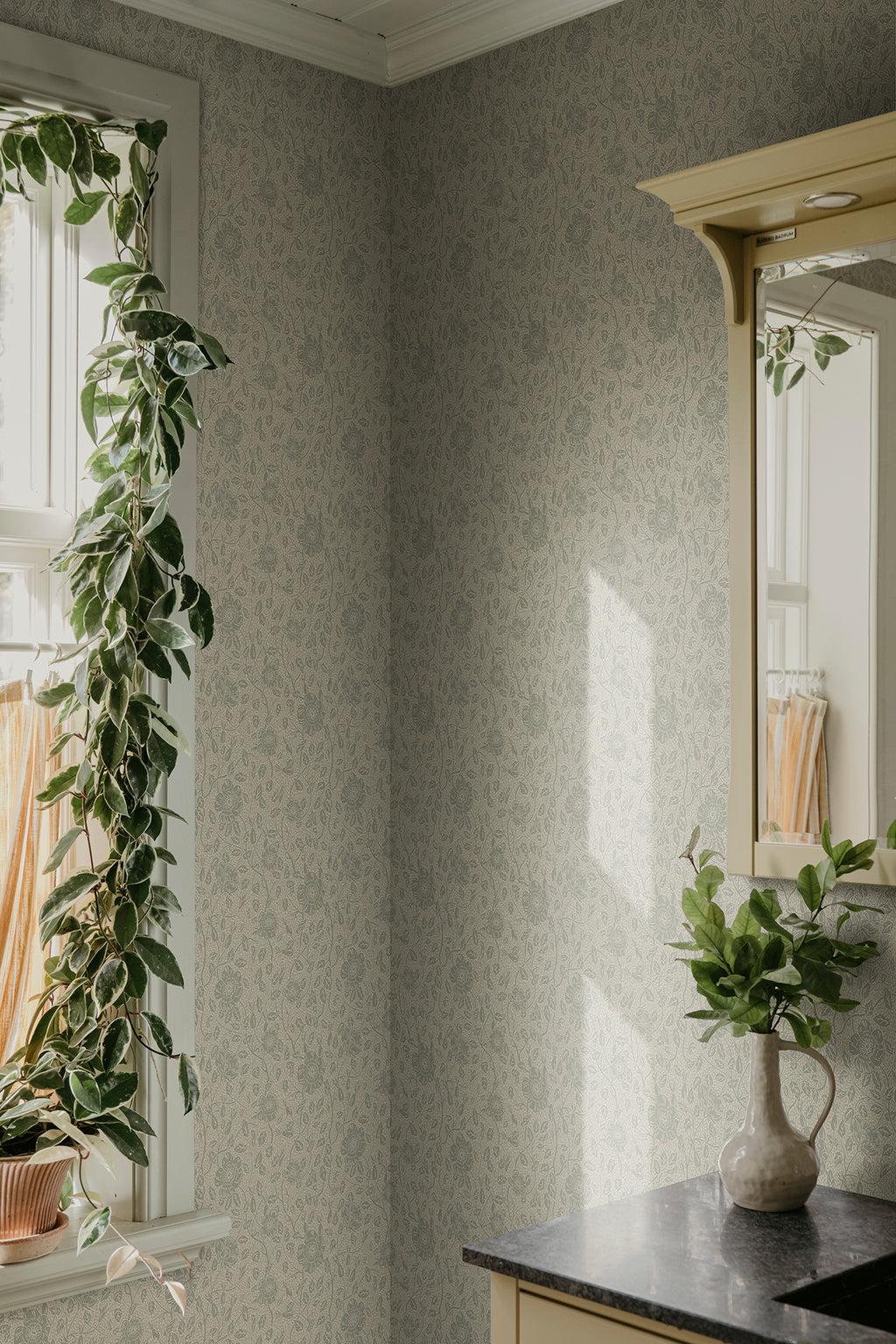 Anton wallpaper by Sandberg in Sage Green, styled on an interior wall