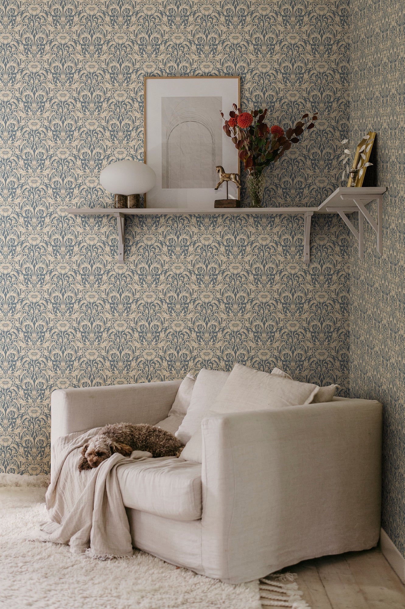 Emil wallpaper by Sandberg in Indigo Blue, styled on an interior wall