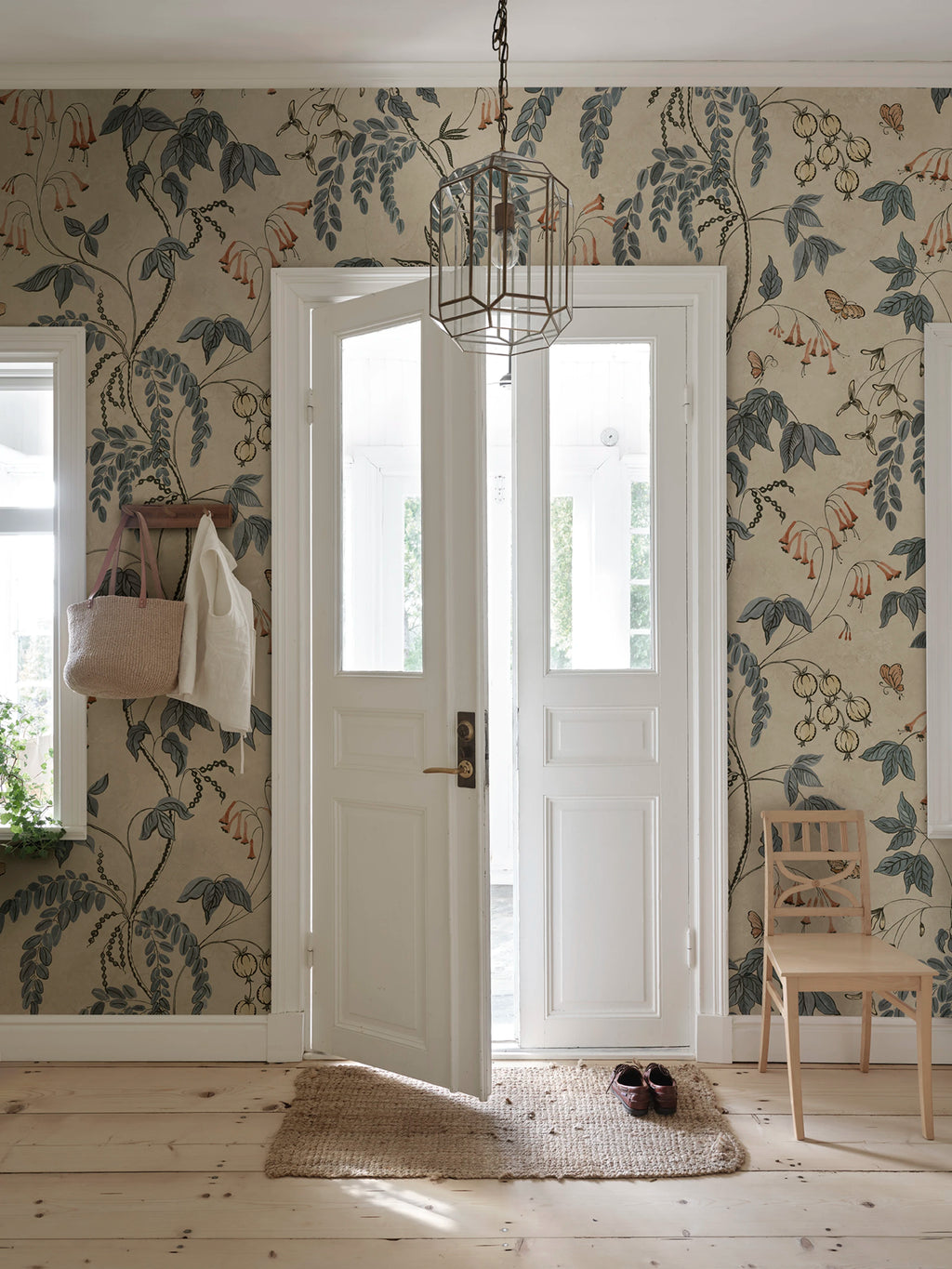 Ottilia wallpaper by Sandberg – floral design, Misty Blue, styled on an interior wall