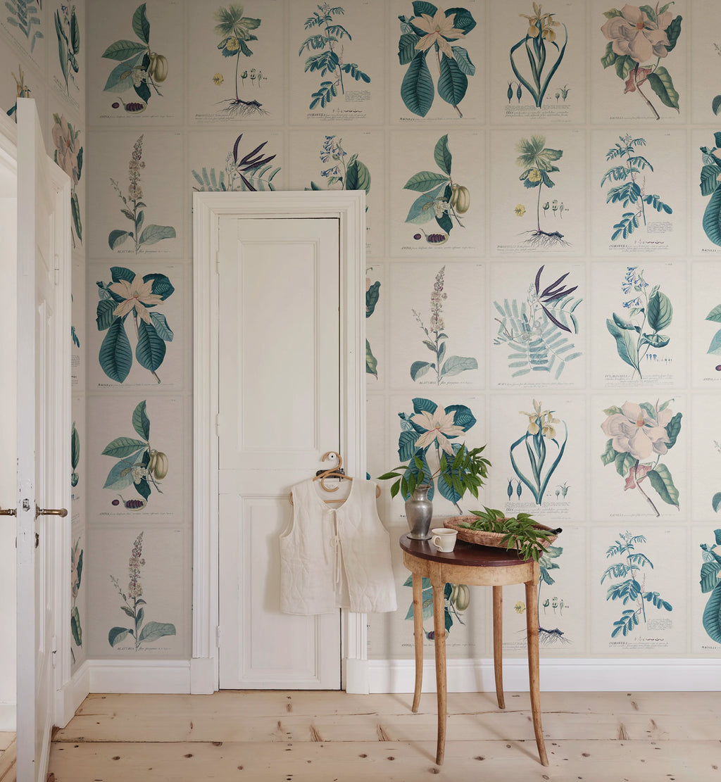 Flora wallpaper by Sandberg – botanical design, Blue, styled on an interior wall