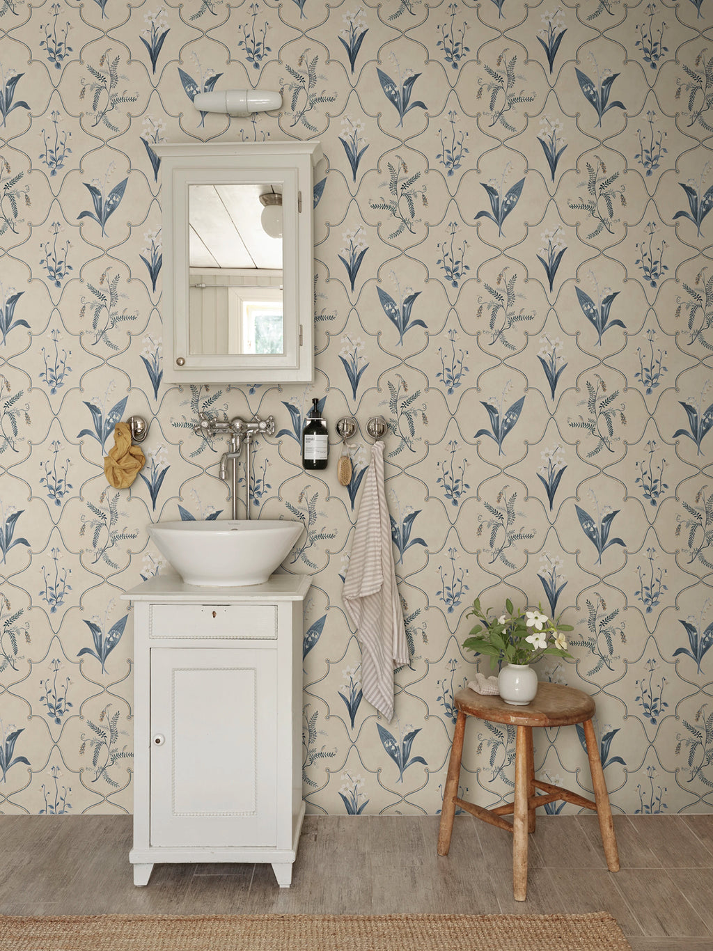 Louise wallpaper by Sandberg – Blue colourway, styled on an interior wall