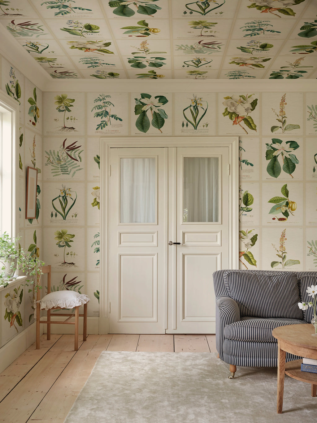 Flora wallpaper by Sandberg – botanical design, Green, styled on an interior wall