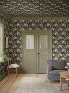 Lilian wallpaper by Sandberg – botanical design, Charcoal, styled on an interior wall