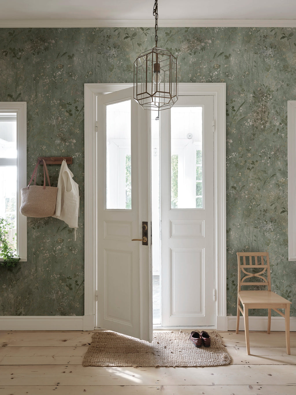 Juni wallpaper by Sandberg – floral design, Sage Green, styled on an interior wall