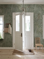 Juni wallpaper by Sandberg – floral design, Sage Green, styled on an interior wall
