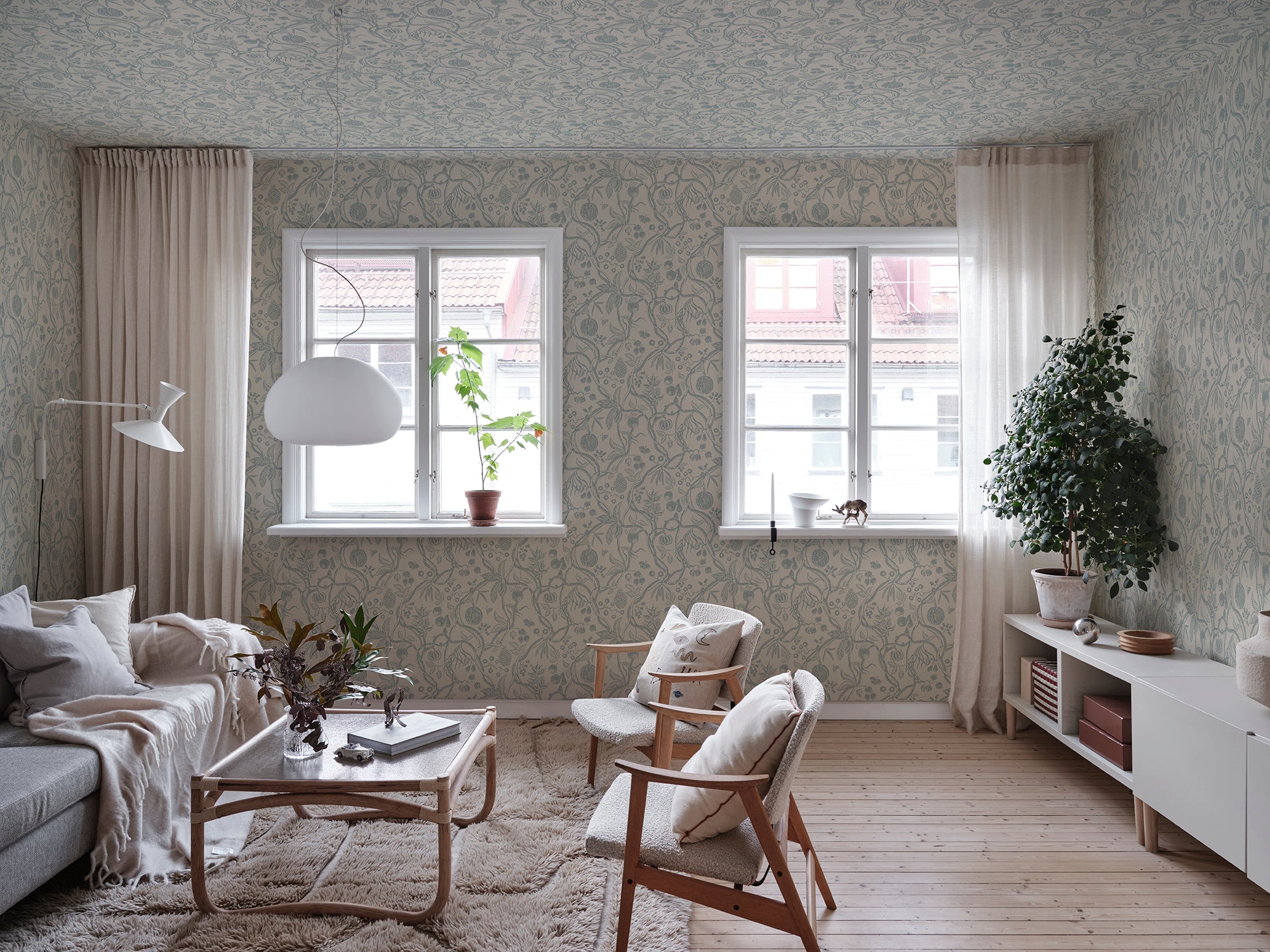 Tree of Life wallpaper by Sandberg in Light Blue, styled on an interior wall