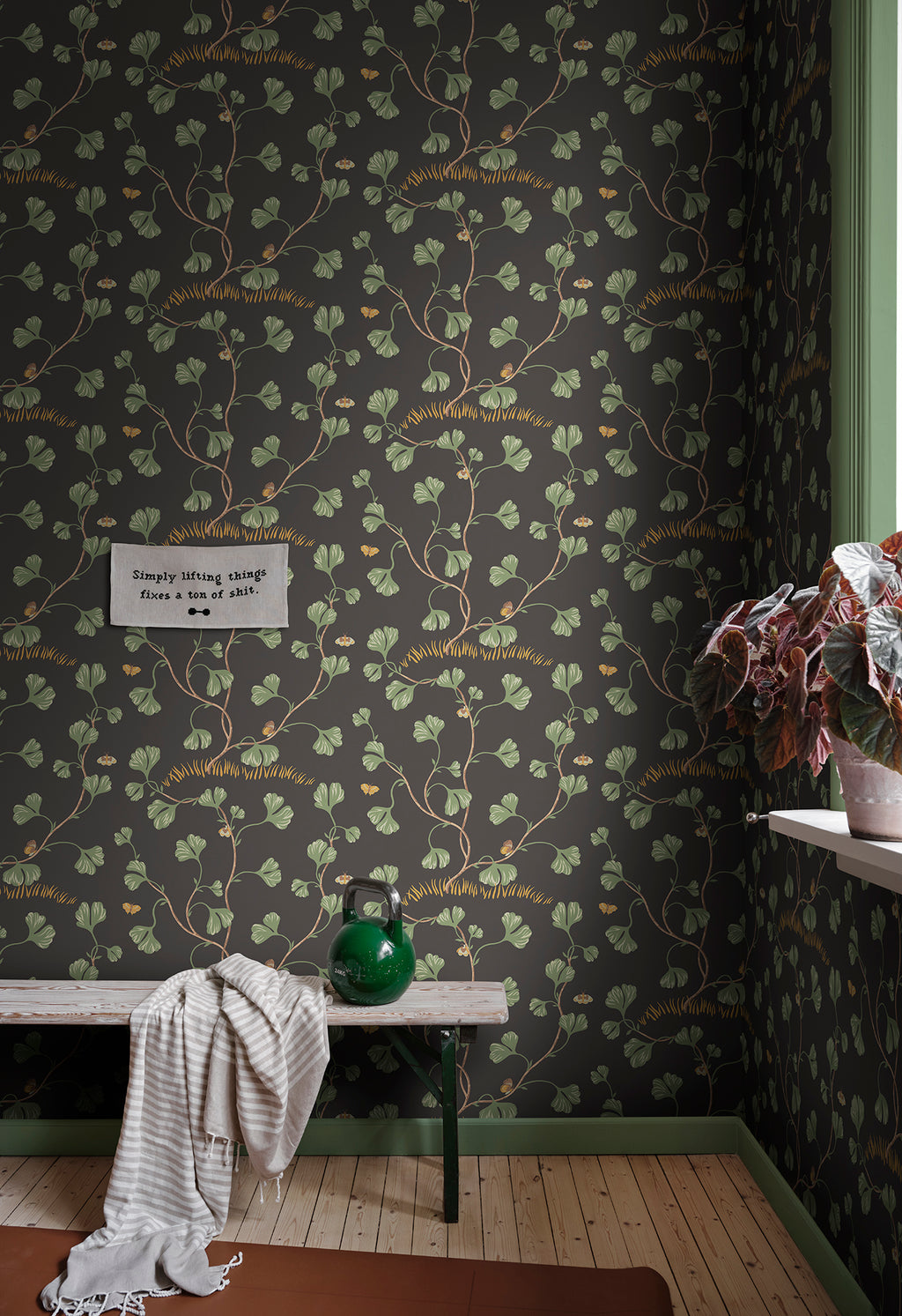 Ebba wallpaper by Sandberg in Charcoal, styled on an interior wall