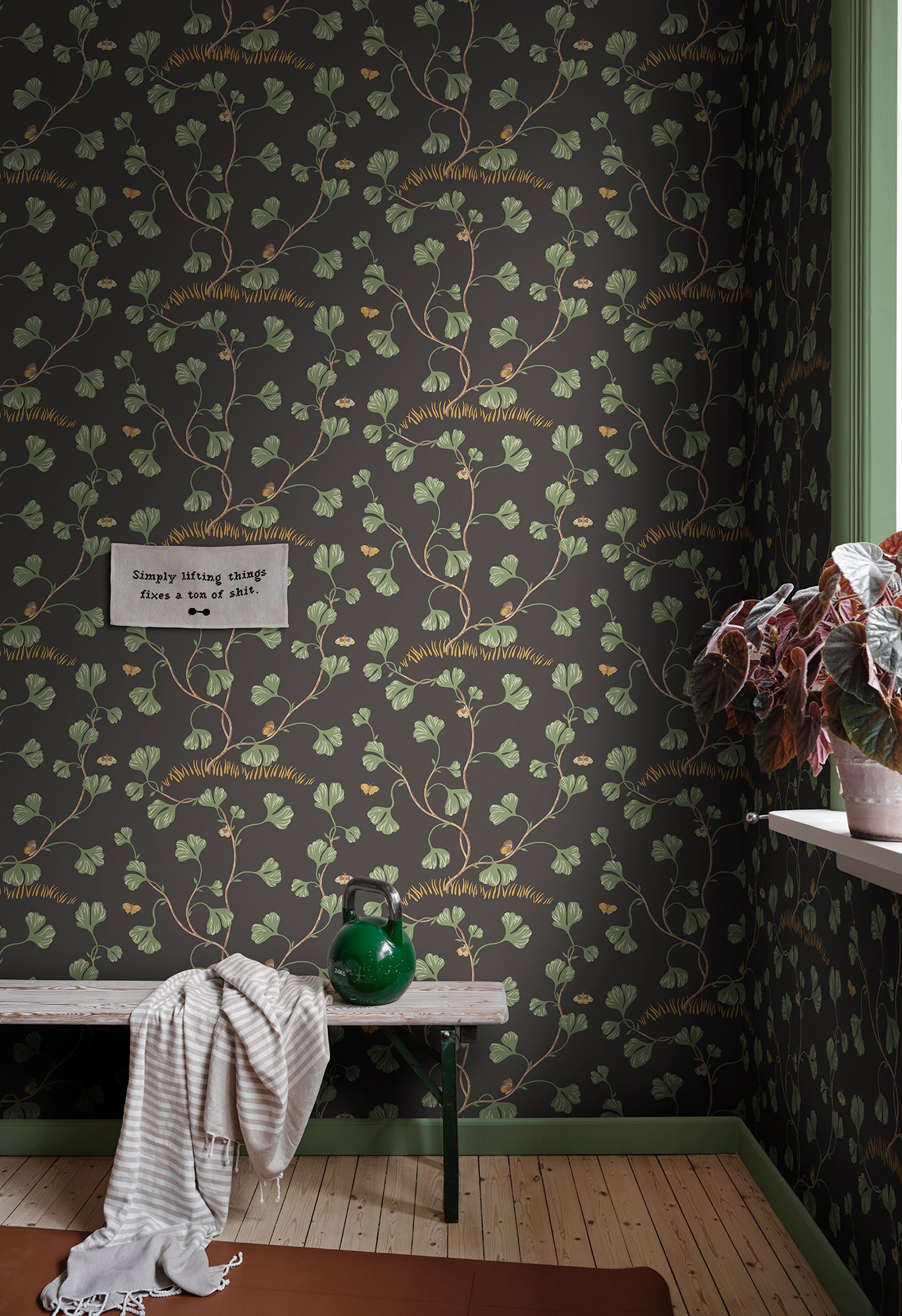 Ebba wallpaper by Sandberg in Charcoal, styled on an interior wall