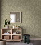 Celeste wallpaper by Sandberg in sage green in an entryway behind a timber console with mirror, plant and baskets