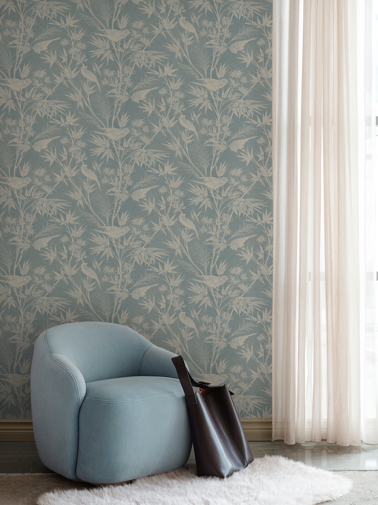Celeste wallpaper by Sandberg in Misty Blue, styled on an interior wall