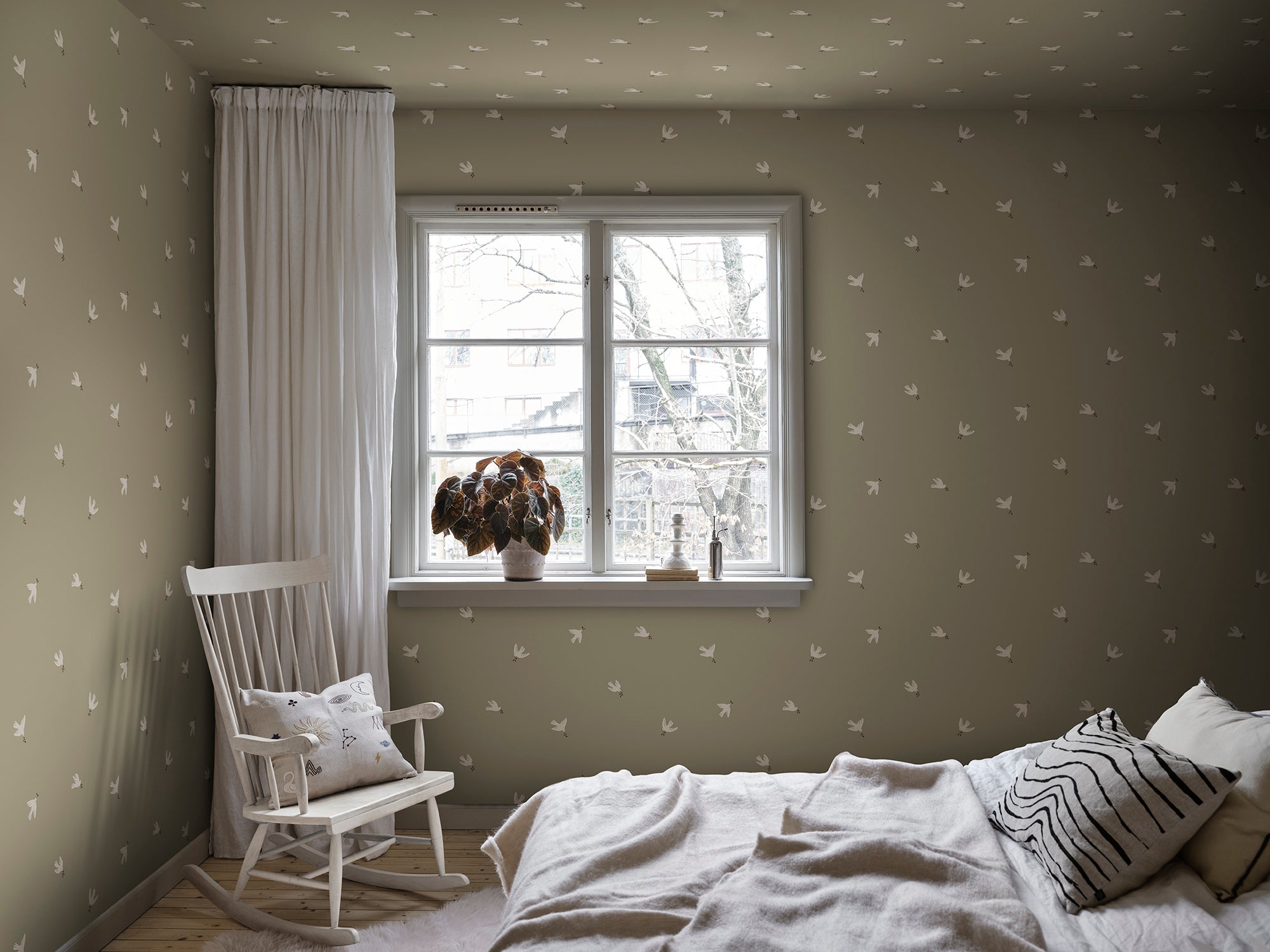 Frida wallpaper by Sandberg in Olive Green, styled on an interior wall