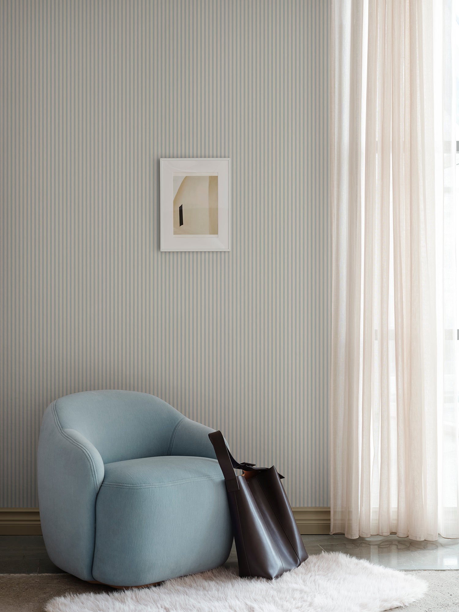 Estelle wallpaper by Sandberg in Light Blue, styled on an interior wall