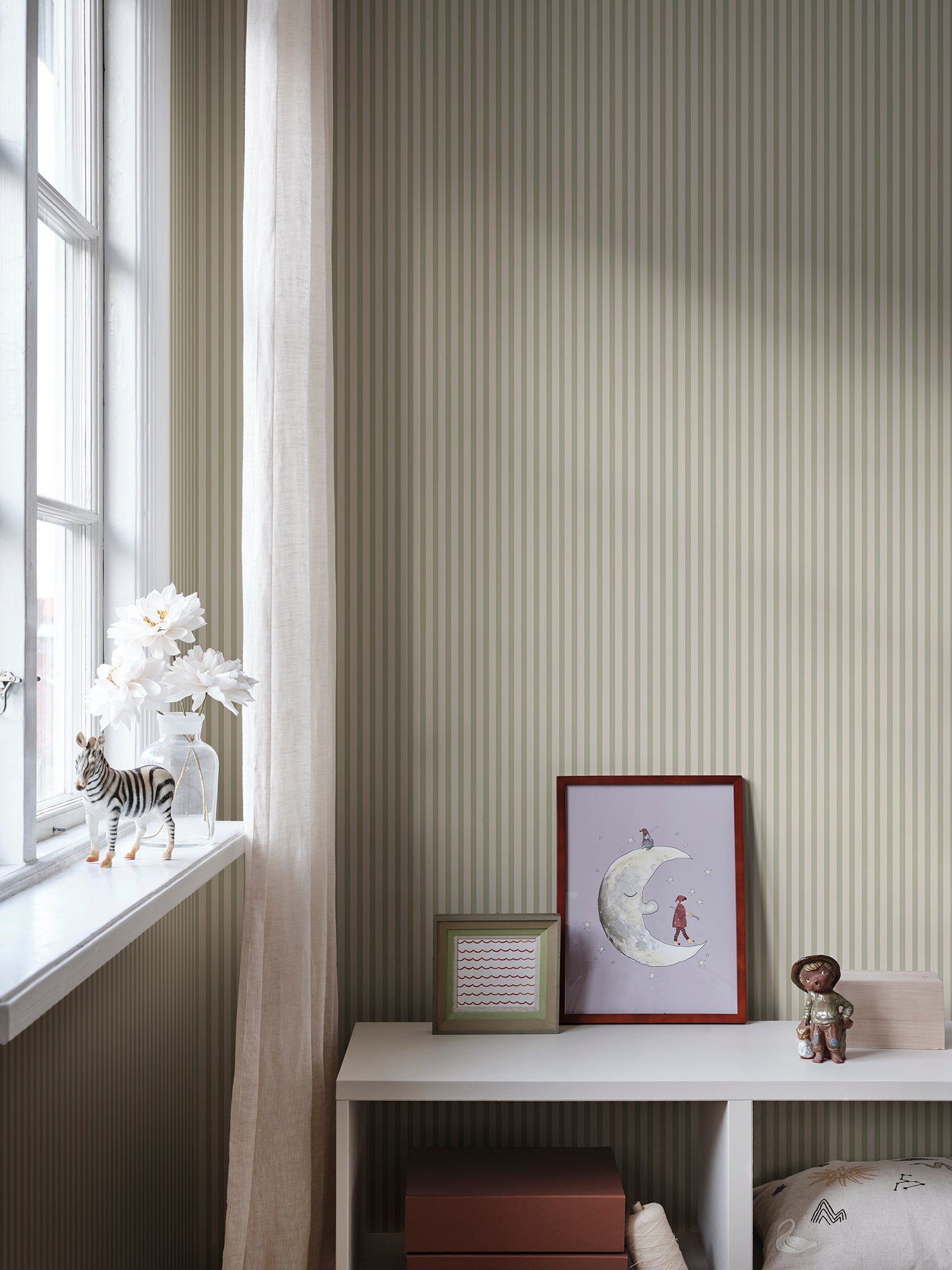 Estelle wallpaper by Sandberg in Light Green, styled on an interior wall