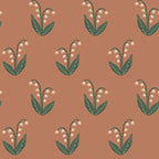 Lilly wallpaper by Sandberg in terracotta, cream lily-of-the-valley sprigs with dark green leaves, flat roll swatch