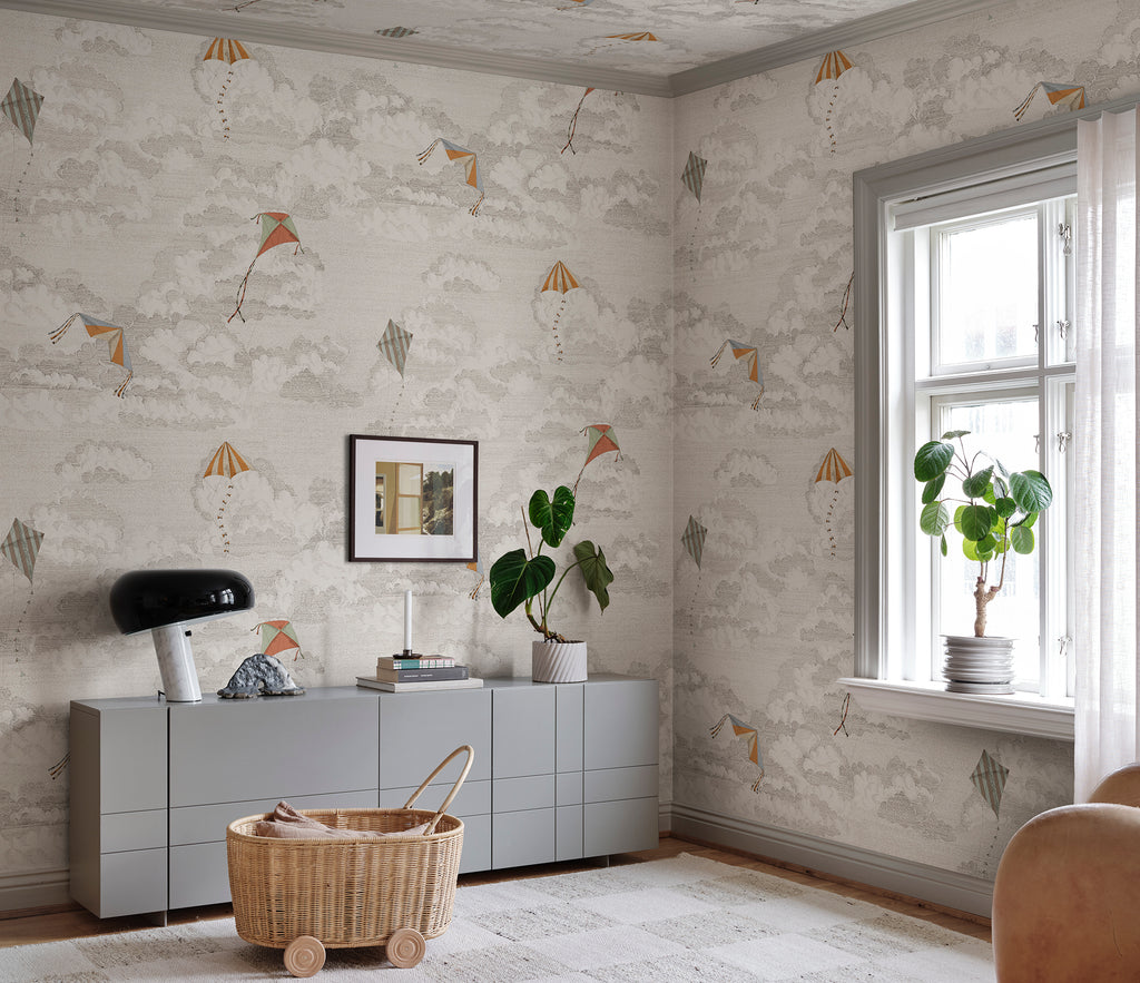 Bonnie & Kites wall mural by Sandberg in beige styled in a living room with grey sideboard and plants
